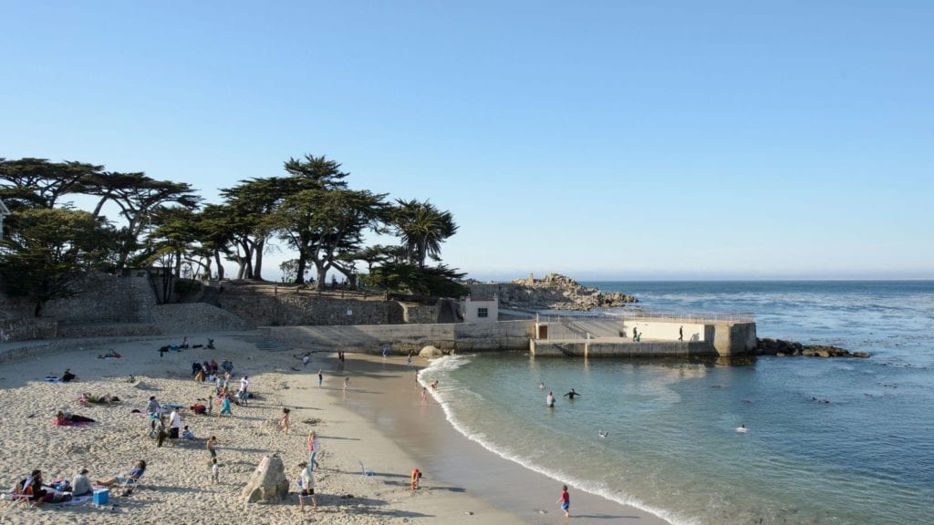 Monterey Beach: Lovers Point Park and Lovers Point Beach in Pacific Grove in daytime with beachgoers