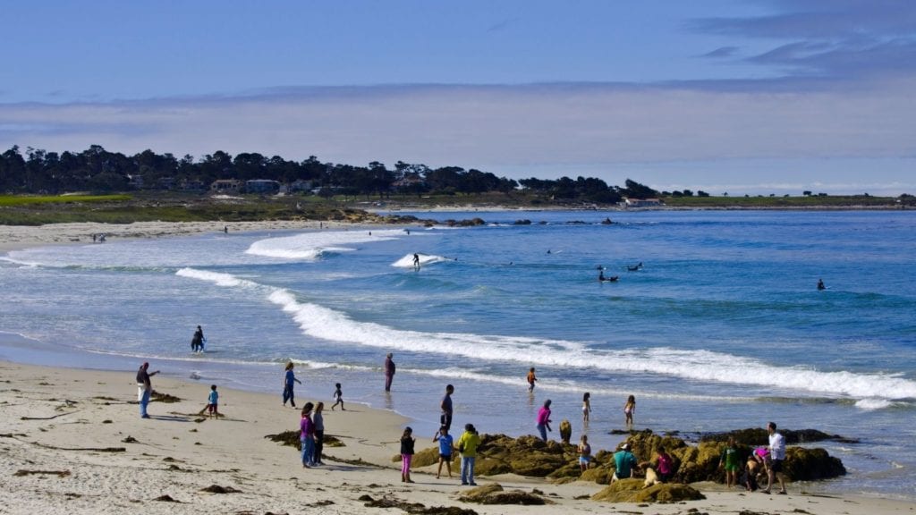 Monterey's Asilomar State Beach in daytime with beachgoers
