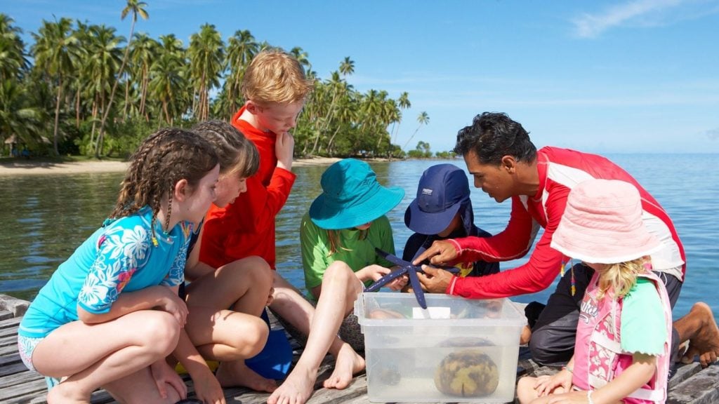 biologist teaching kids at the Jean-Michel Cousteau Resort in Fiji, one of the best beach all-inclusive resorts in the world