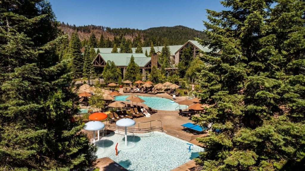 view of pools and buildings at Tenaya Lodge, places to stay near Yosemite