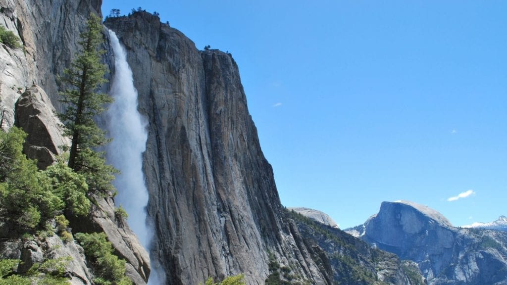 Yosemite Falls with Half Dome in Background in Yosemite National Park; national parks in spring