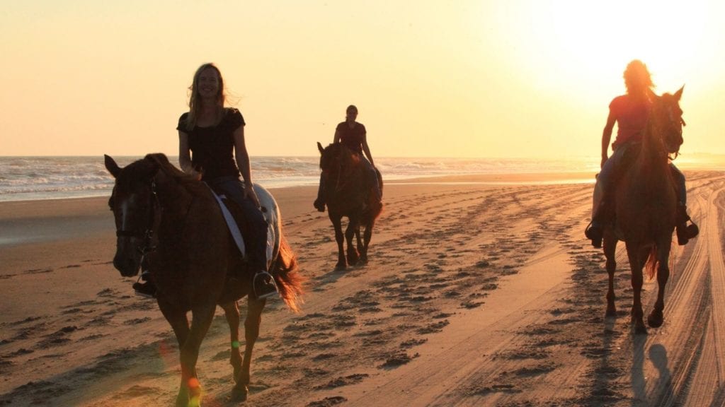 Horseback riding on the beach at Cape Hatteras, Outer Banks (Photo: Outerbanks.org)