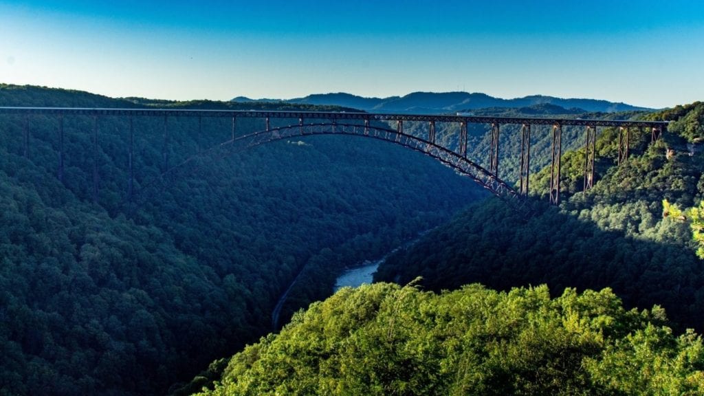New River Gorge Bridge with sunlight and shade. This new national park is one of the best vacation spots for couples, especially outdoorsy people
