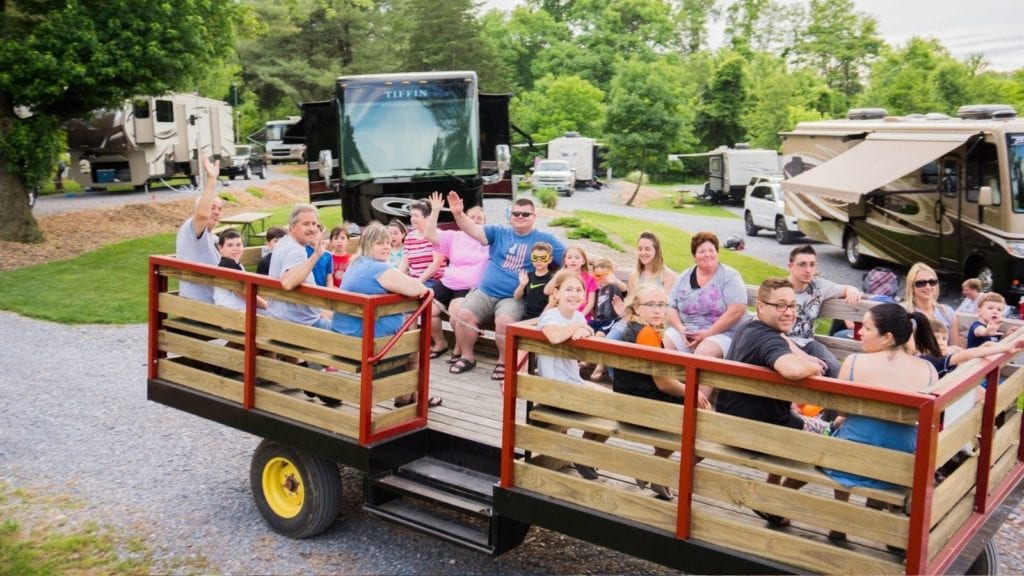 Campers waving from a hayride at Elizabethtown/Hershey KOA (Photo: Elizabethtown/Hershey KOA)