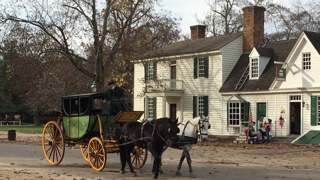 horse and carriage in front of house in Colonial Williamsburg. Colonial Williamsburg is one of the top U.S. tourist attractions