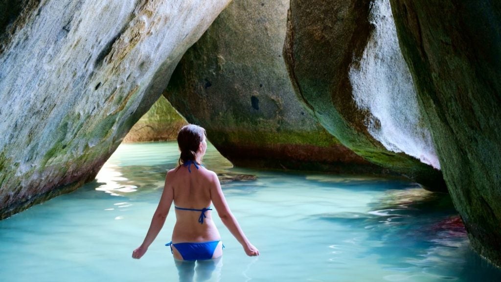 Woman at The Baths in Virgin Gorda, British Virgin Islands (Photo: BlueOrange Studio via Shutterstock)