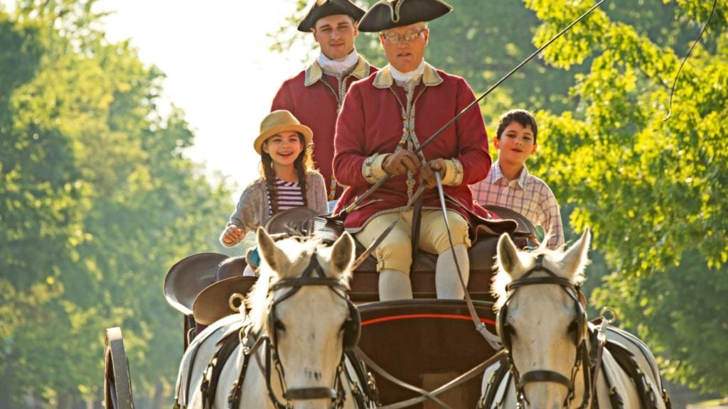 Family taking a horse and carriage ride in Colonial Williamsburg (Photo: Virginia Tourism)