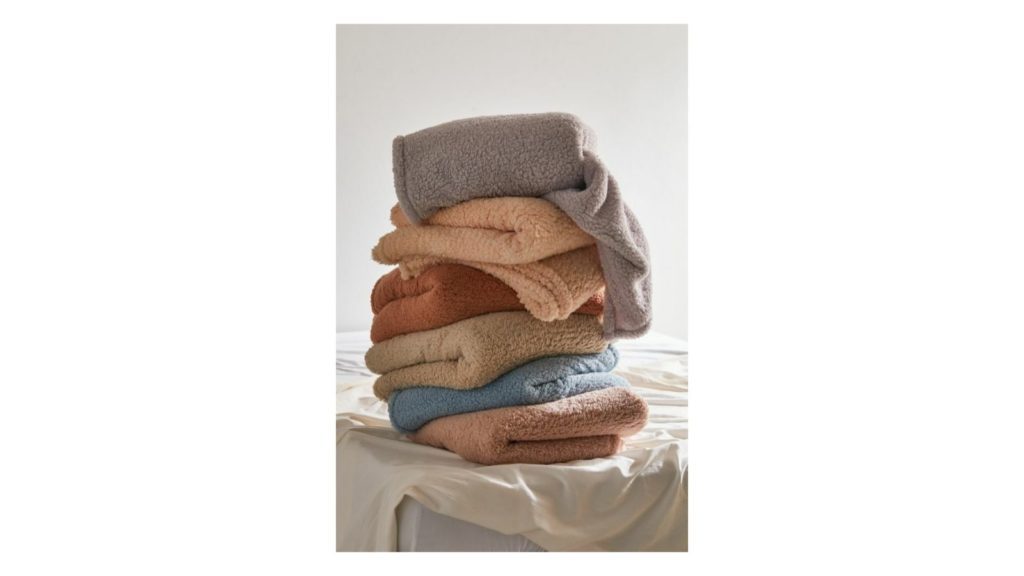 Urban Outfitters Amped Fleece Throw Blanket (Photo: Urban Outfitters)