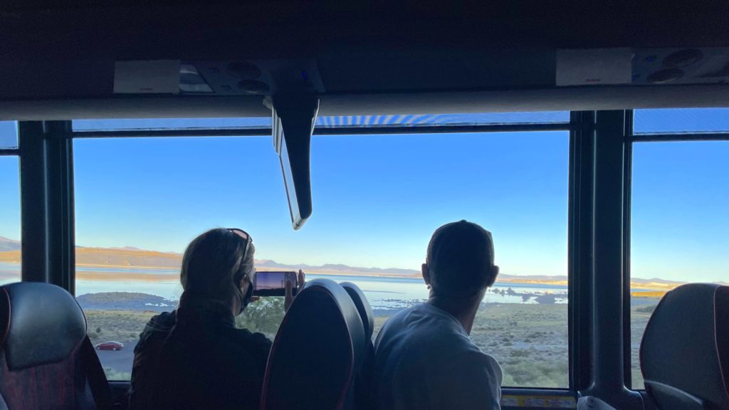 passengers aboard Globus' California Dreamin’: Northern California by Design tour bus look out at Mono Lake