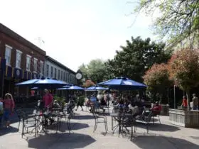 Historic riverwalk in Savannah with places to eat and tables