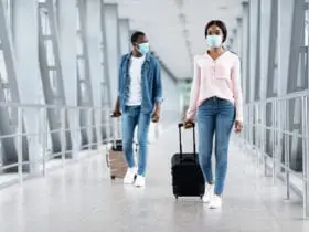 Man and woman in safety masks at airport