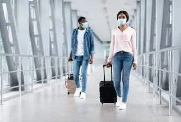 Man and woman in safety masks at airport