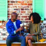 Couple toasting with coffee in Yorktown near Williamsburg