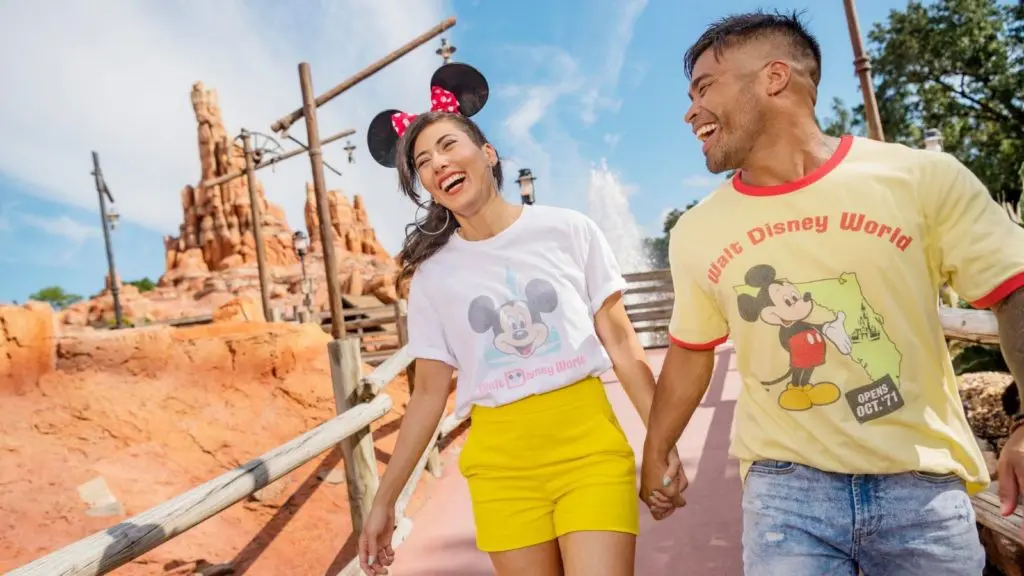 Couple holding hands at Walt Disney World (Photo: Walt Disney World)