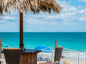 Thatched umbrella and table overlooking the water in Vero Beach Florida