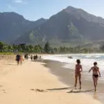 Family on a beach in Kauai, Hawaii (Photo: Shutterstock)