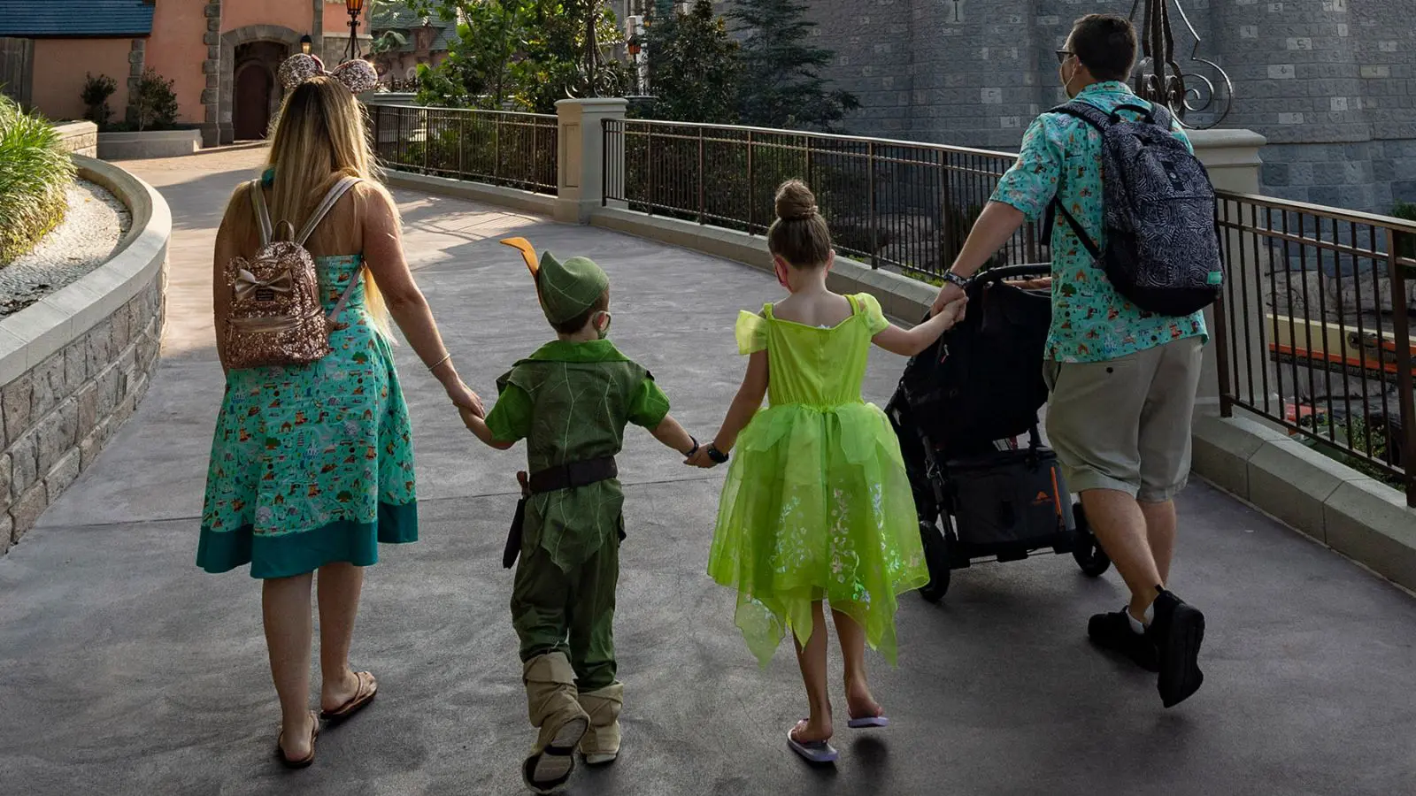 Family walking through Fantasyland near Cinderella's Castle in Magic Kingdom (Photo: Disney)