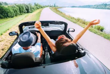 Couple in a convertible rental car (Photo: Shutterstock)
