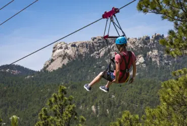 Person on the zipline at Rushmore Tramway Adventures