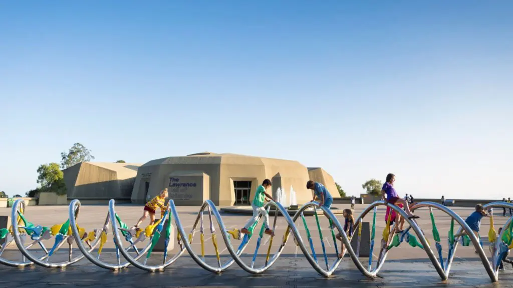 View of children playing on the DNA sculpture outside the Lawrence Hall of Science in Berkeley