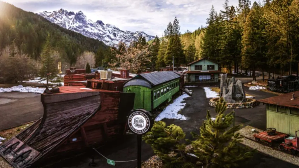 View of Railroad Park Resort in winter with snowy mountains in background