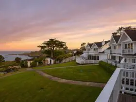sunset view of Little River Inn in Mendocino and Pacific Ocean in the background