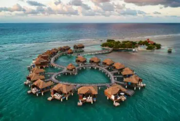 An aerial view of the overwater bungalows at Sandals Royal Caribbean