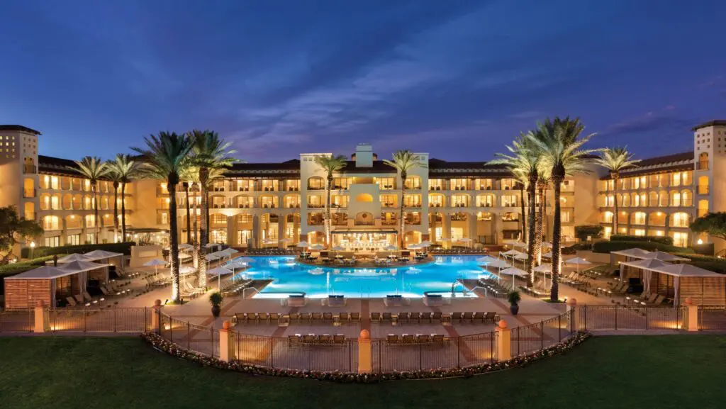 A nighttime view of one of the pools at Fairmont Scottsdale Princess