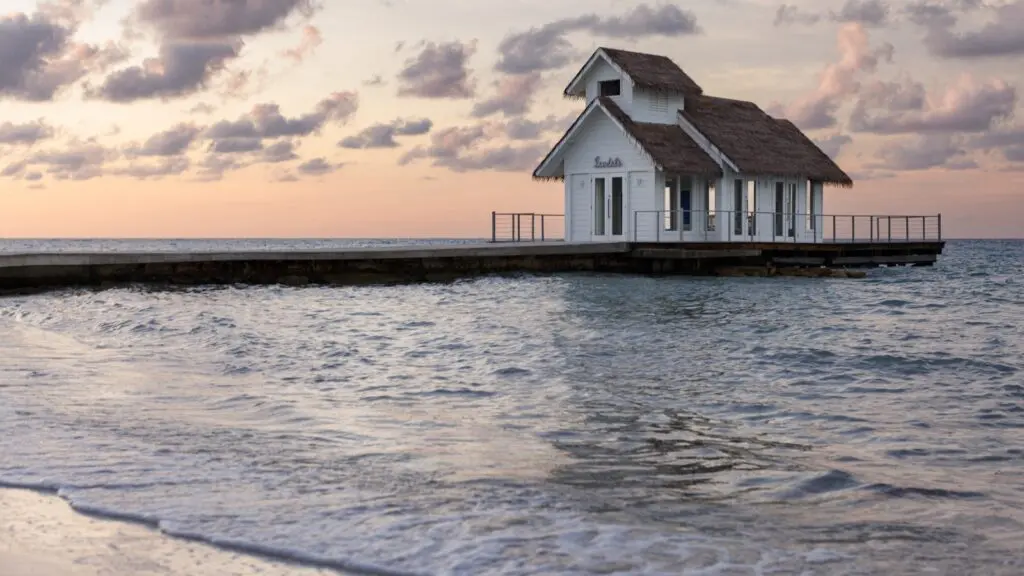 A sunset view of the overwater wedding chapel at Sandals Montego Bay