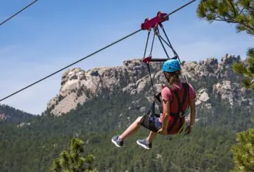 Person on the zipline at Rushmore Tramway Adventures