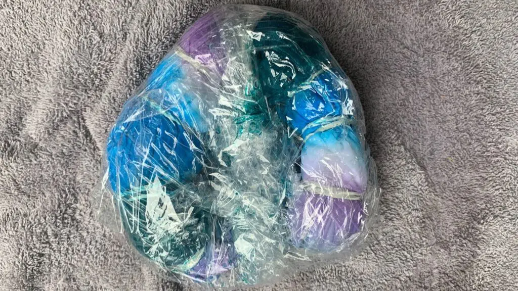 Disney tie dye shirt after it has been dipped but before it has been unrolled and rinsed