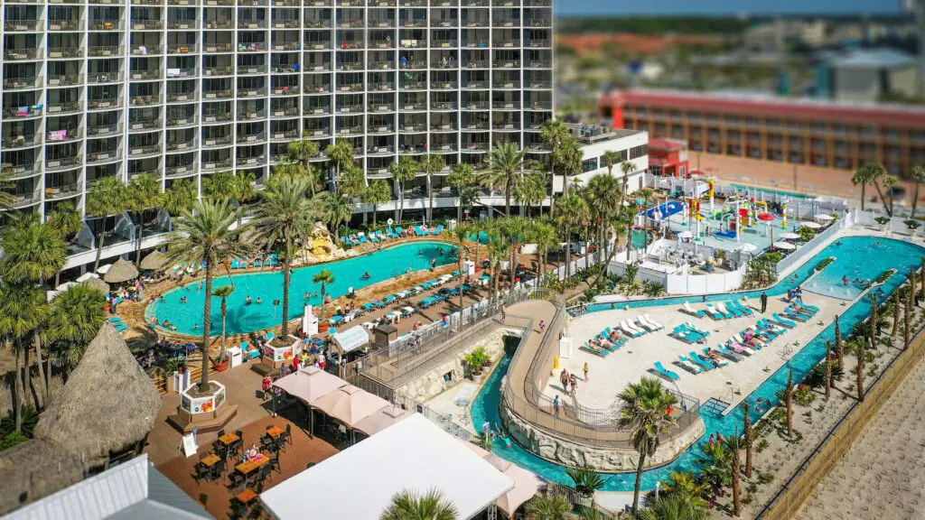 An aerial view of the pool and lazy river along the beach at Holiday Inn Panama City Beach
