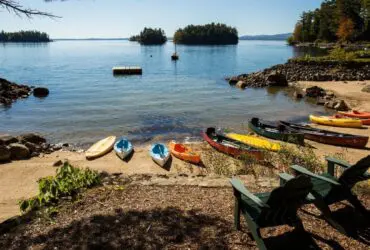 kayaks on the beach at Migis Lodge in South Casco, Maine