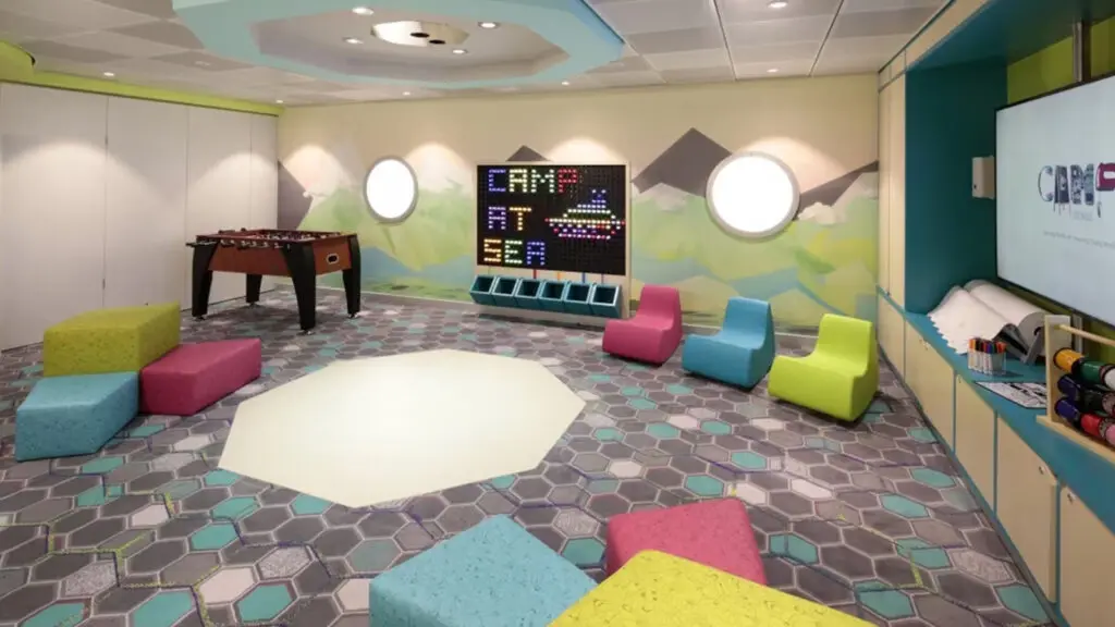 Colorful lounge space for kids with games, cushion chairs, and a TV