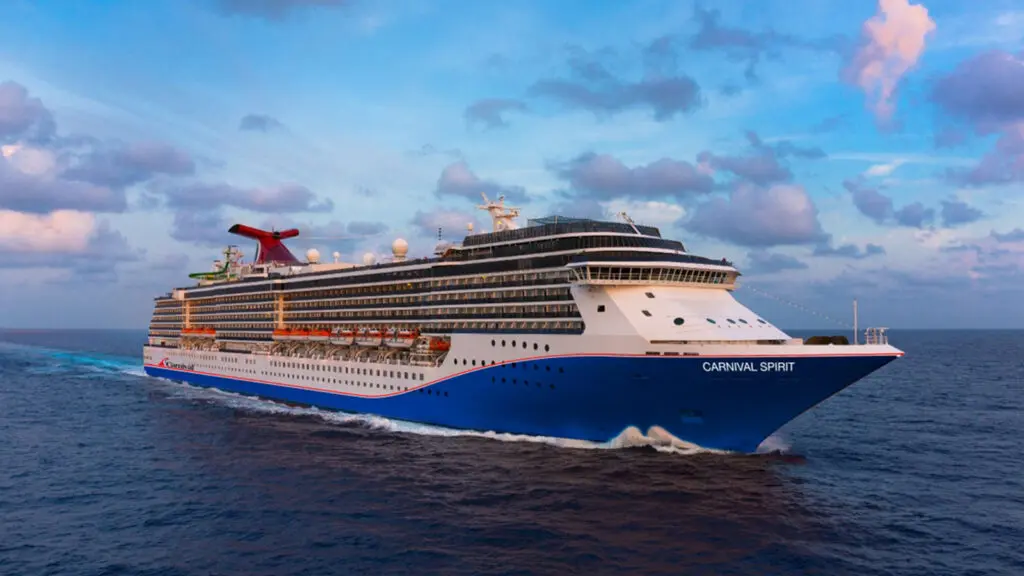 Cruise ship sailing at sunset