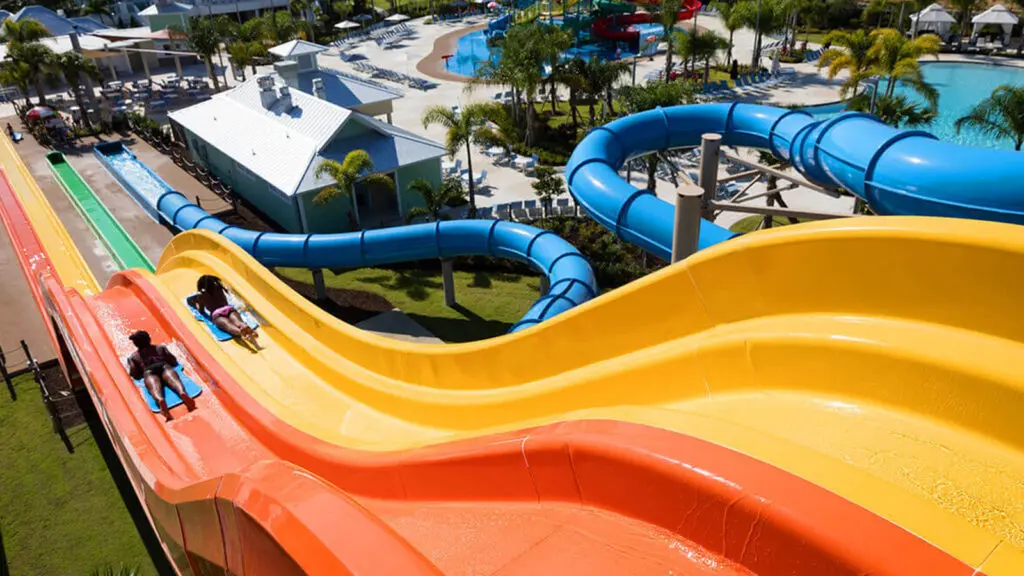 Kids sliding down water slides