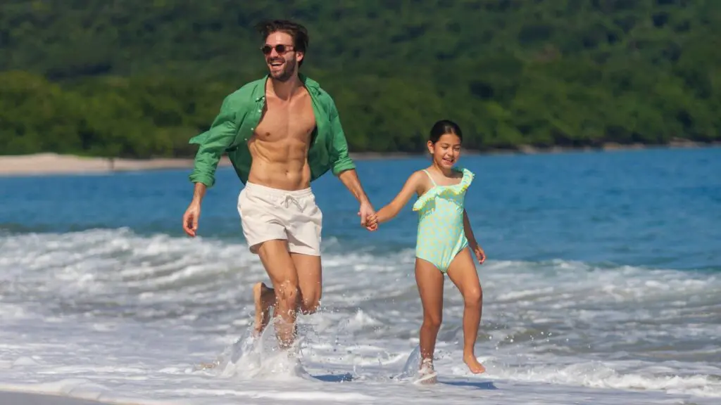 A father and daughter at the beach at The Westin Reserva Conchal
