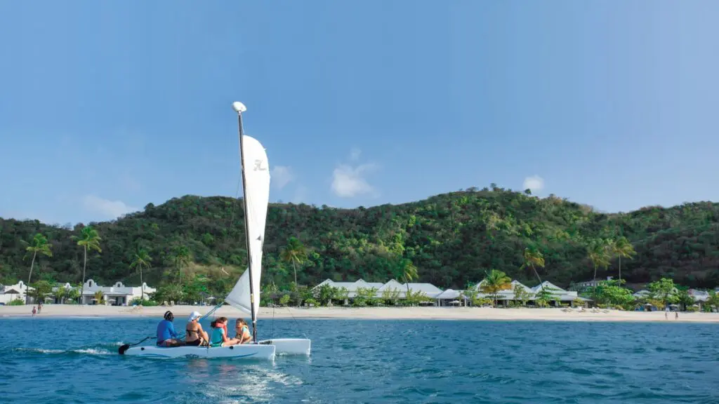 Kids and adults on a sailboat at Spice Island