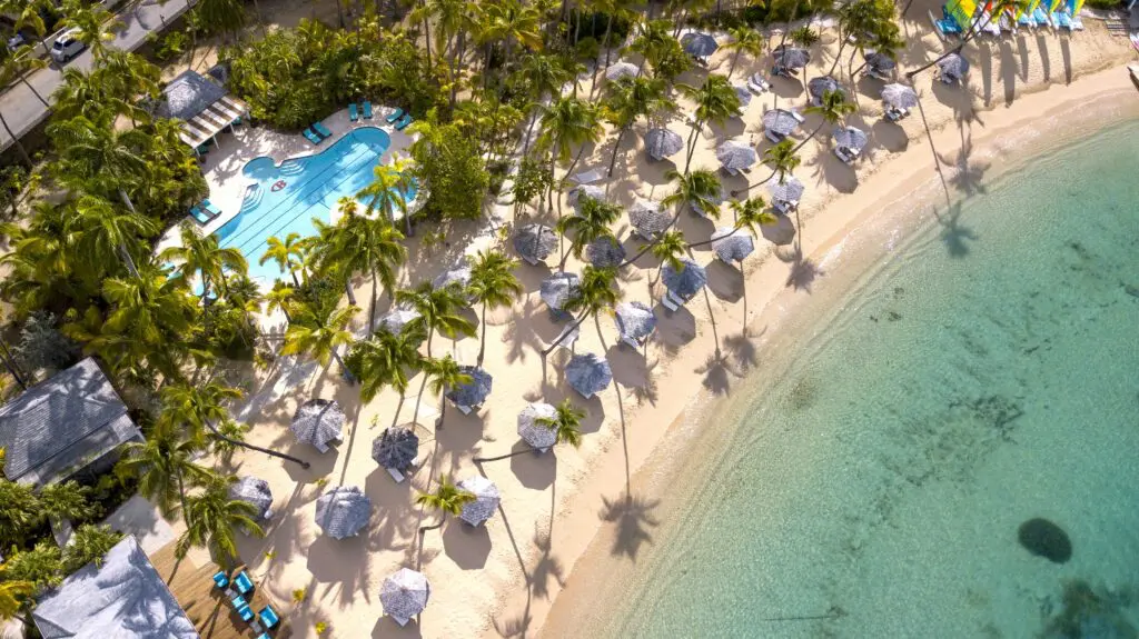 An overhead view of the beach and pool at Curtain Bluff