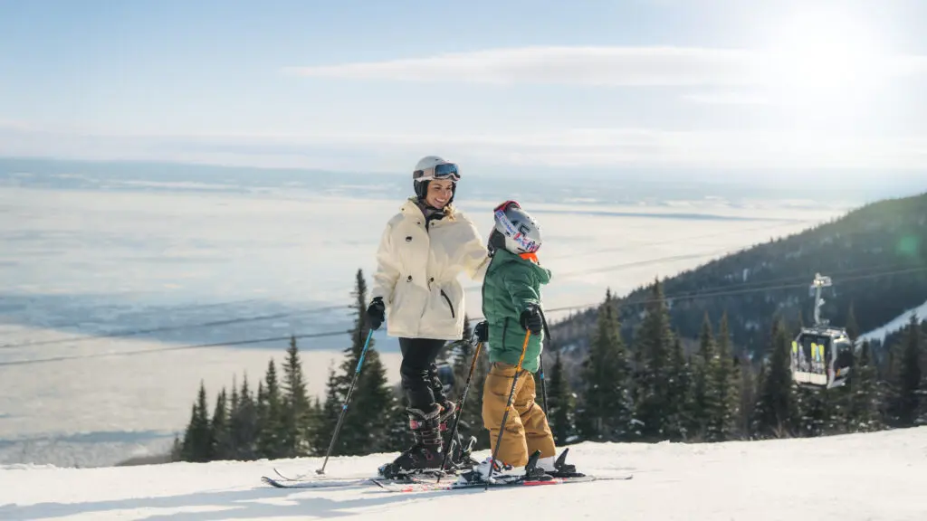 A mother and child on a ski slope at Club Med Québec Charlevoix