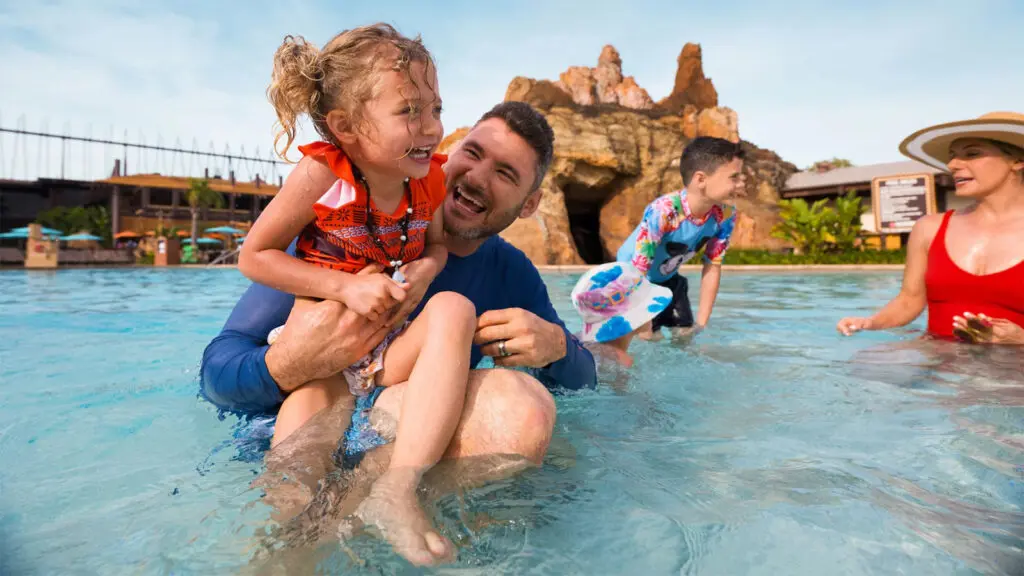 Family playing in swimming pool