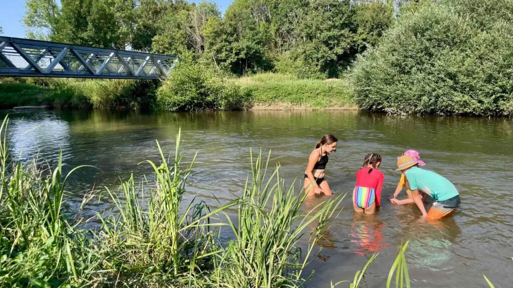 Kids playing in a river in Burgundy in France