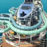 Top deck of cruise ship with two tube slides winding around