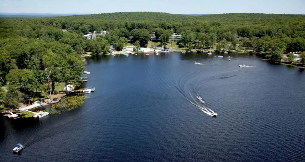 An overhead view of the lakefront at The Pines at Woodloch with boats in the water