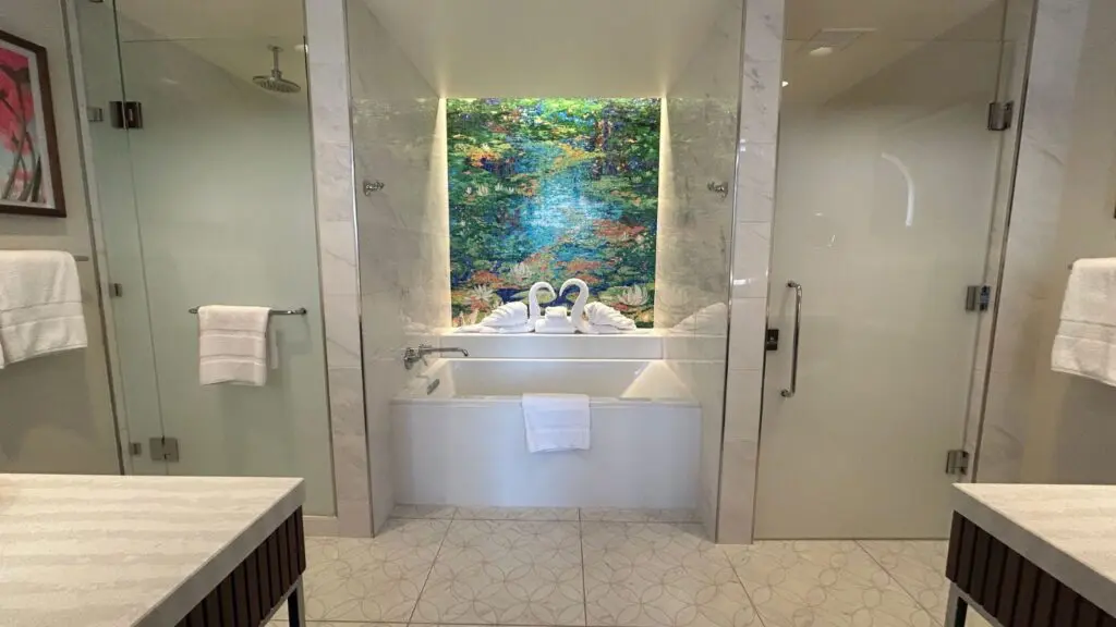 The main bathroom has a large soaking tub, a walk-in shower, and dual vanities (Photo: Josh Roberts)