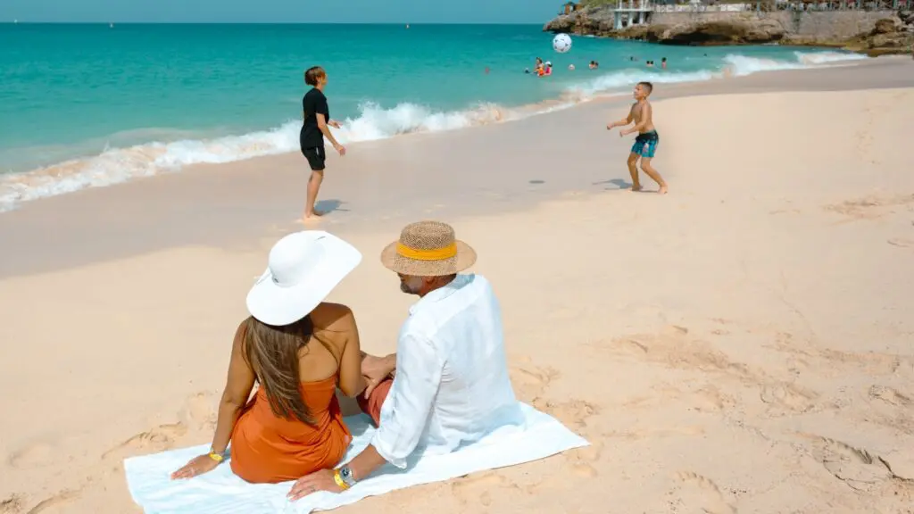 A family on the beach at Sonesta Maho Beach Resort