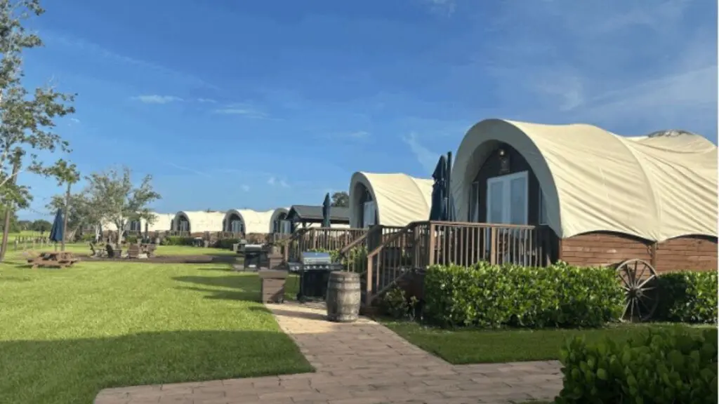 Line of Conestoga wagon accommodations at Westgate River Ranch in Florida