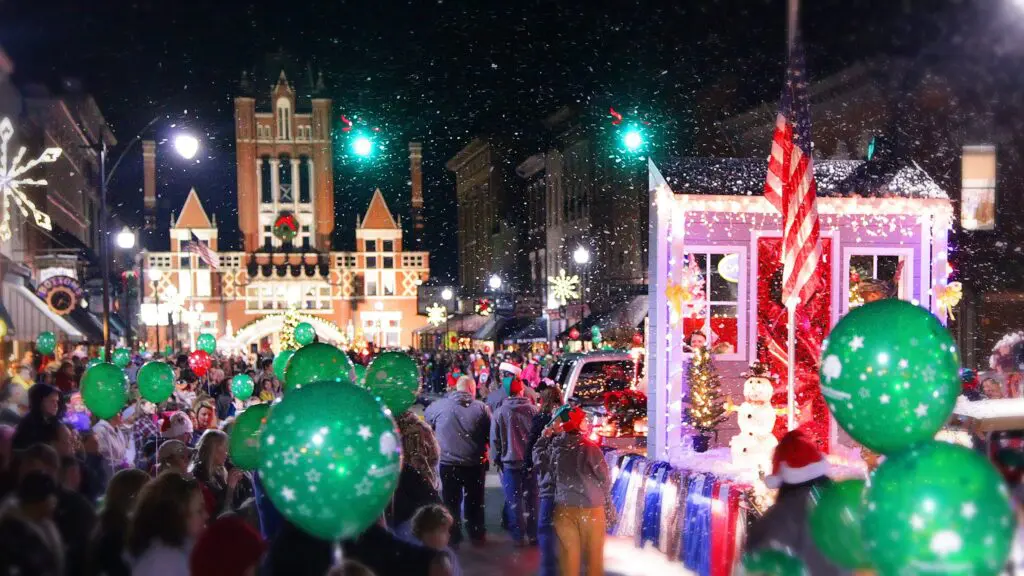 A holiday parade with floats, lights, and balloons in Bardstown, KY