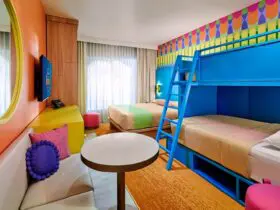 A rendering of a brightly colored guest room at Universal Kids Resort Hotel