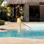 French person reading a book in the pool at Club Med Punta Cana